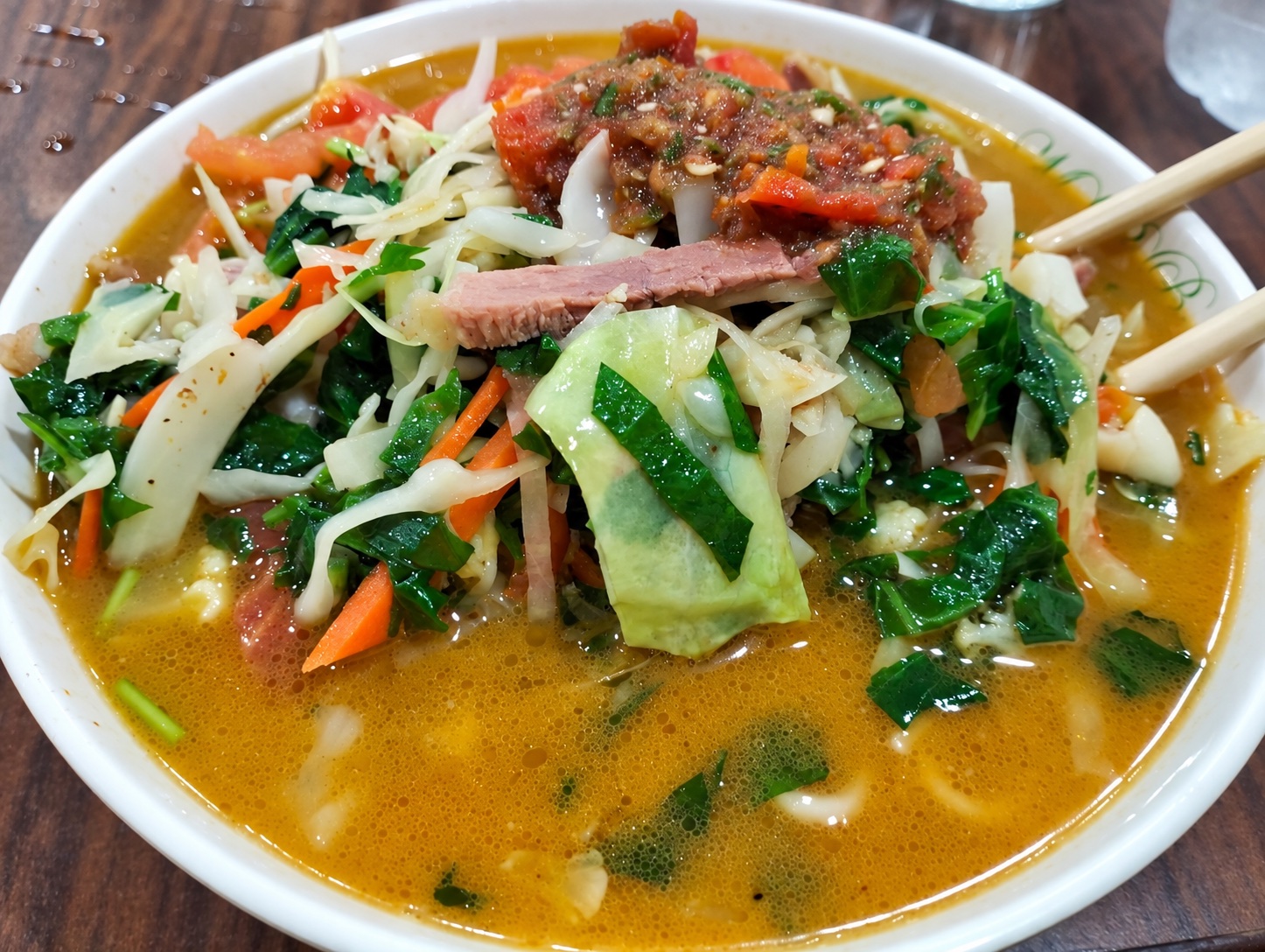 A generous bowl of noodle soup with vegetables at Mohammad Restaurant